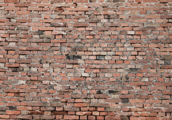Wall built of jointed red bricks