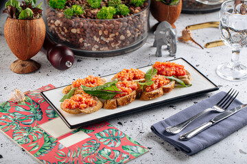 Gourmet salmon bruschetta appetizer dish on decorated background