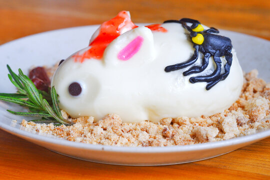 Halloween rabbit cheesecake on the dish.