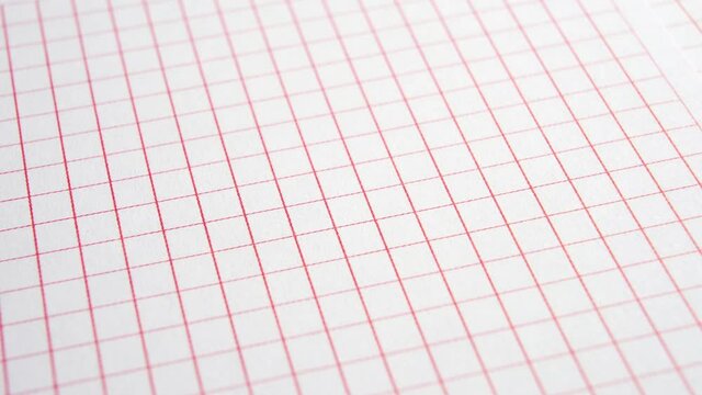 Blank paper squared pattern page. Empty school checkered sheet. Red white sheet. Macro. Dolly shot