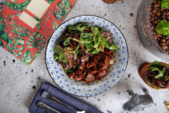 Gourmet Warm Horse Meat Salad With Greens In Ginger Dressing