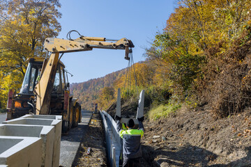 Construction site road burial of u-shaped gutter precast concrete drain