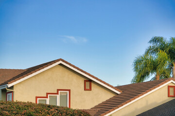 Top exterior of a house with brown bricks roof at Southern California