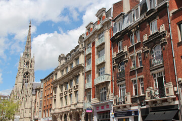 ancient flat buildings and church - lille - france