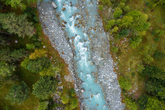 Drone view of Ova da Morteratsch river flowing through Val Morteratsch