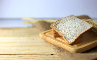 Fototapeta na wymiar Soft and delicious sliced bread on table