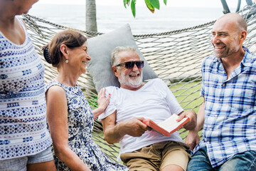 Senior group relaxing in a hammock - Powered by Adobe