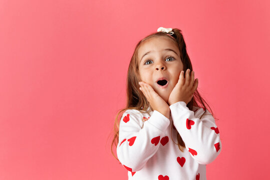 Cute Young Girl On Pink Background Making Surprised Face