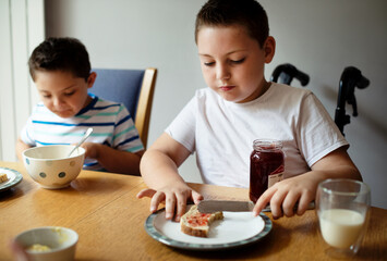 Boys having breakfast in the morning