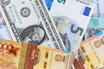 Banknotes of the USA, Europe, Russia and Kazakhstan. Currency exchange concept. International financial relations. Money background. Flat lay. Selective focus.