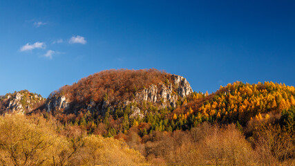 Mountainous landscape with rocks and forests in autumn. Podskalsky Rohac National Nature Reserve in Strazov Mountains Protected Landscape Area, Slovakia, Europe.