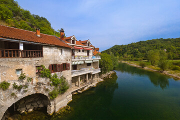 Fototapeta na wymiar Old Bridge in Rijeka Crnojevica River near Skadar Lake - Montenegro