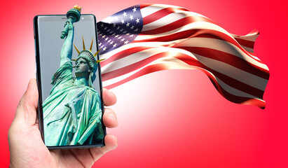 USA symbols on phone. Human hand with flag and statue of liberty. Statue of Liberty in mobile app. Visualization of America flag on red background. USA symbols. Statue of Liberty symbolizes New York