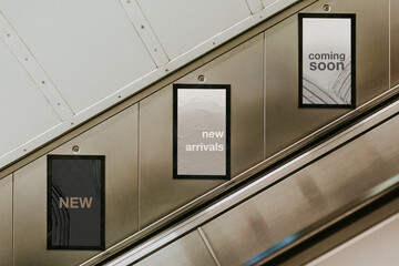 Billboard screens by underground escalator - obrazy, fototapety, plakaty