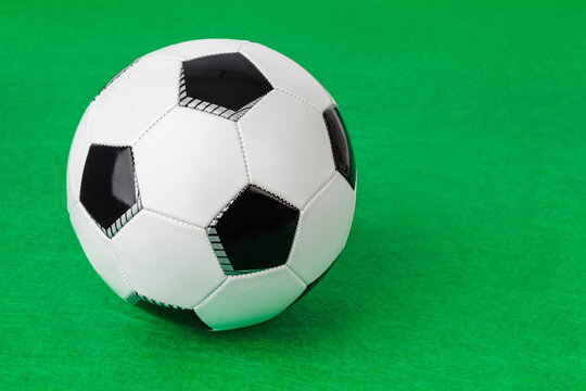 Soccer ball on football field