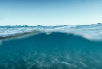 Split View Half Over and Under Ocean Surface whit Clear Sky. Background Concept