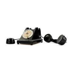 Vintage black bakelite telephone on white background