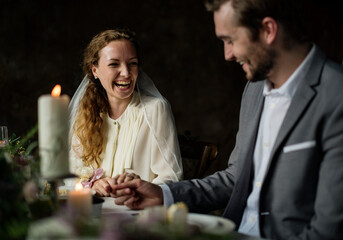 Couple at the wedding day reception table