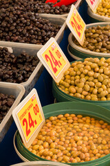 Sun-dried green olives. The olives are sold at the market counter.