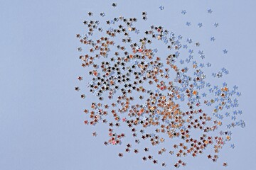 Festive background with small glittering stars, copy space for text