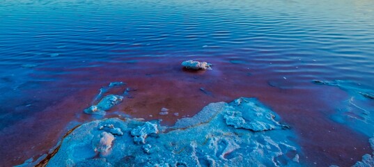 The Salinas of Torrevieja at sunset, a lagoon that produces salt by evaporation and is pink in color due to the microorganisms that inhabit it