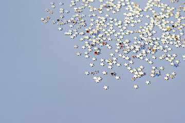 Festive background with small glittering stars, copy space for text