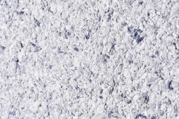 Abstract textured wallpaper. Decorative texture. Colored texture of liquid wallpaper to cover wall surface. Colored abstract background. Abstract texture of decorative plaster liquid wallpaper