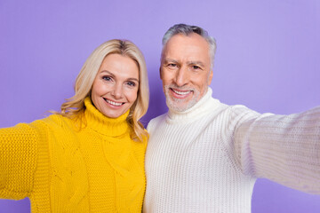 Photo of adorable pretty mature wife husband wear knitted pullovers smiling embracing vlogging isolated purple color background