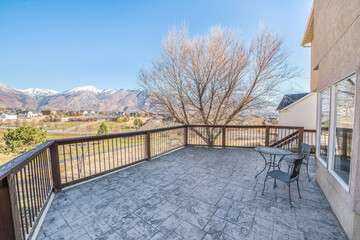 Mountain range view from the veranda of a two-storey house