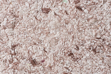 Abstract textured wallpaper. Decorative texture. Colored texture of liquid wallpaper to cover wall surface. Colored abstract background. Abstract texture of decorative plaster liquid wallpaper