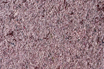 Abstract textured wallpaper. Decorative texture. Colored texture of liquid wallpaper to cover wall surface. Colored abstract background. Abstract texture of decorative plaster liquid wallpaper