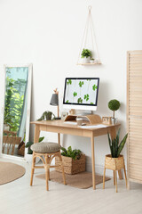 Stylish room interior with comfortable workplace. Home office
