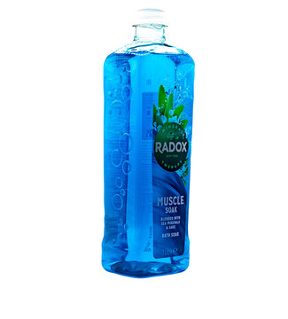 Norwich, Norfolk, UK &ndash; November 2021. A bottle of Radox Muscle Soak bubble bath cut out isolated on a plain white background