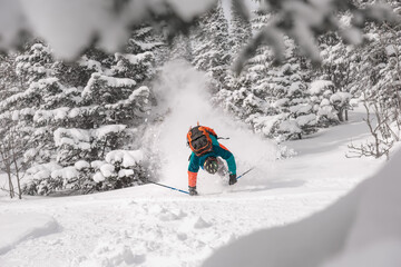 Ski accident with rider falling in forest