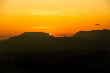 The sun was setting on the edge of the ridge Mountain. sunset