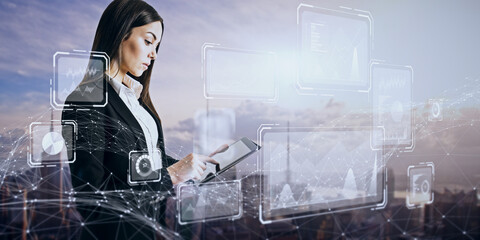 Attractive young european businesswoman using tablet with creative business chart hologram on blurry city background. Innovation, finance, trade, future, ai and technology concept. Double exposure.