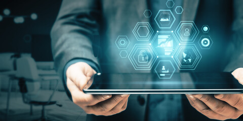 Close up of man hand holding tablet with creative business chart hologram on blurry office interior background. Innovation, finance, trade, future, ai and technology concept. Double exposure.