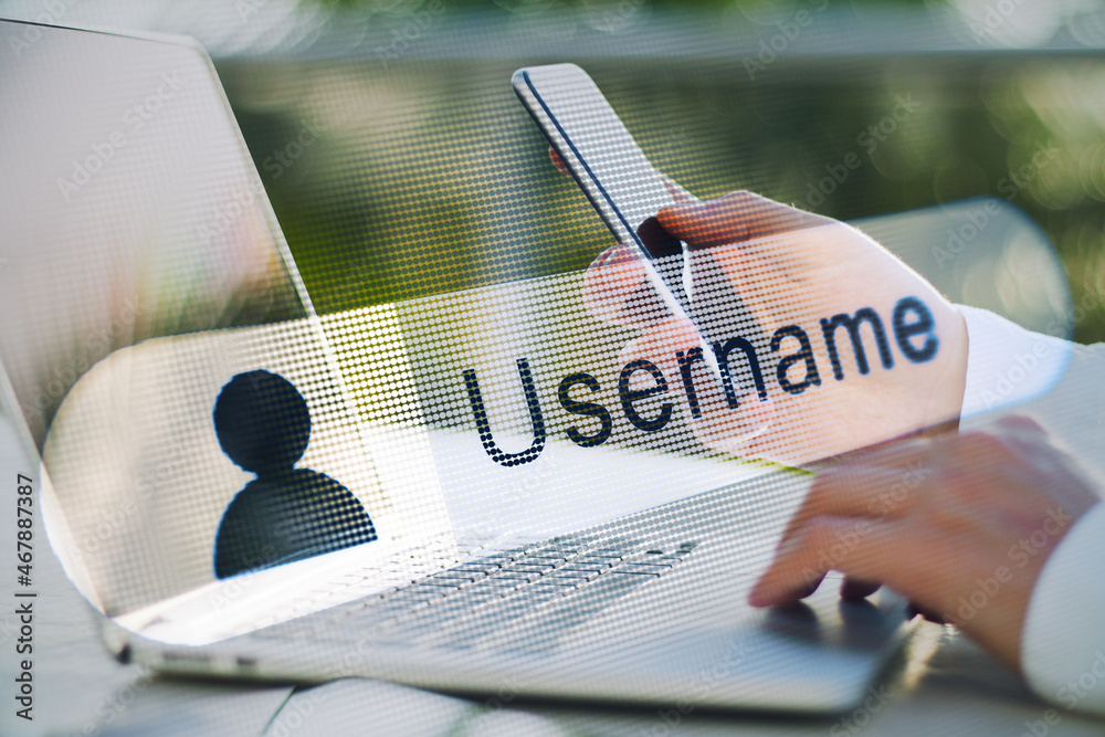 Poster close up of businessman hands using laptop and smartphone with creative username bar on blurry outdo
