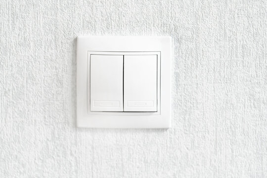 White double light switch on the wall