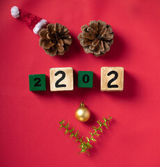 Reindeer face made of Christmas decoration and pine branches. Minimal christmas concept. Flat lay.
