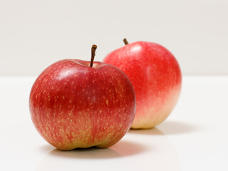 Red apples close-up over the white background