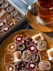 Turkish Delight. view of the tol with a cup of tea and Turkish delight sweets on a plate. A traditional oriental treat is sweetness.