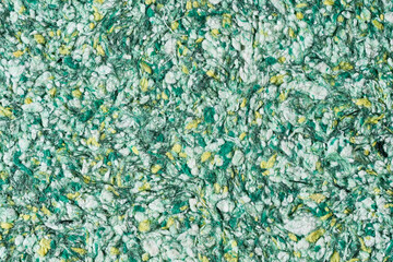 Abstract textured wallpaper. Decorative texture. Colored texture of liquid wallpaper to cover wall surface. Colored abstract background. Abstract texture of decorative plaster liquid wallpaper