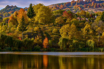 landscape with a mountain lake in autumn on a sunny day