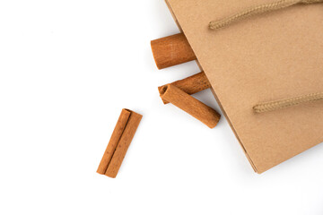 Cinnamon sticks in cardboard bag, healthy cooking ingredient, aroma spice