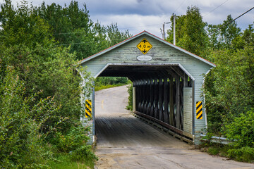 Fototapeta na wymiar Emile Lapointe covered, one of the last covered bridges of Quebec region of Cote Nord, in Canada