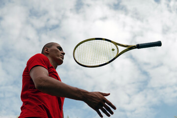 man playing with tennis racket
