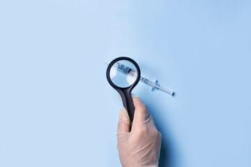 Study of the composition of the new vaccine. Scientist examines the composition of a new drug. A...