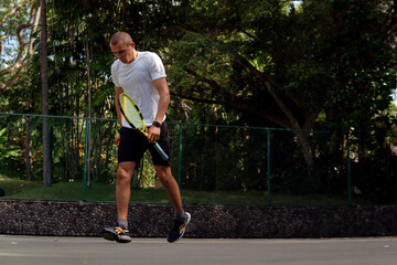 man in white and black sportwear playing tennis