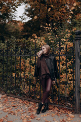 Fototapeta na wymiar beautiful girl with blonde long hair in autumn park